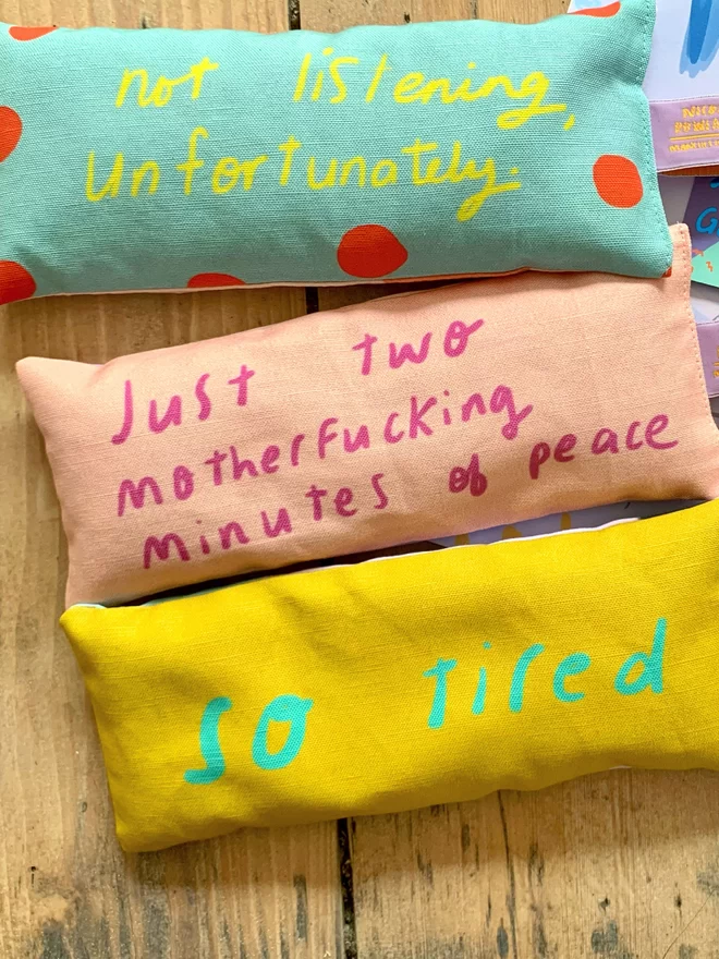 Three different designs of lavender eye pillows designed by Nicola Rowlands in bright, colourful designs. 
