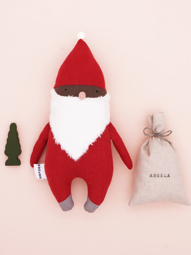 Santa Clause doll with dark skin and red outfit and personalised sack 