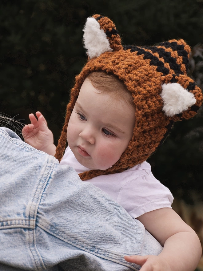 Baby wearing tiger hat