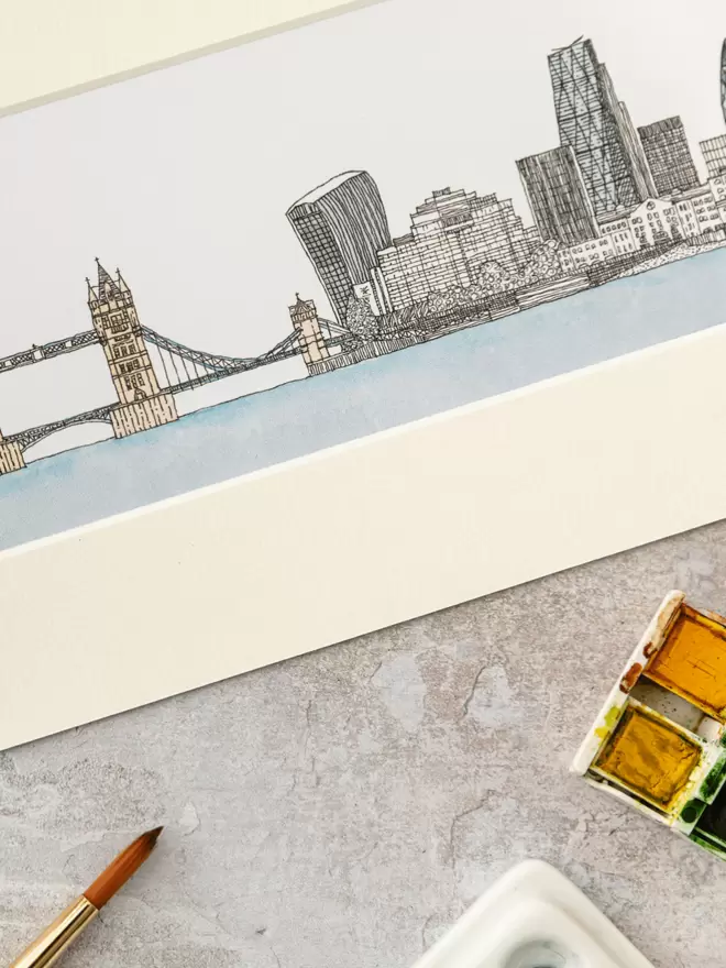 Print of detailed pen and watercolour drawing of Tower Bridge, London and city skyline in a soft white mount