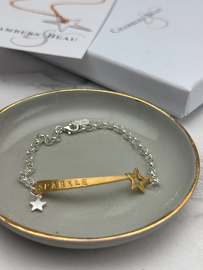 personalised shooting star charm bracelet in gold on silver belcher chain with additional silver star charm. gift box and pouch