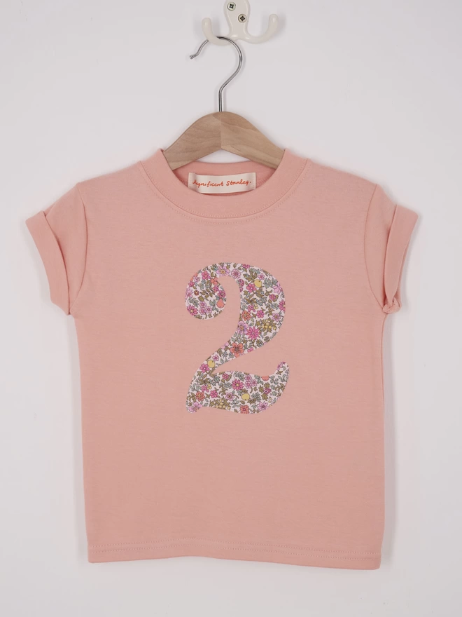 a pink t-shirt appliquéd with a number 2 in floral Liberty print