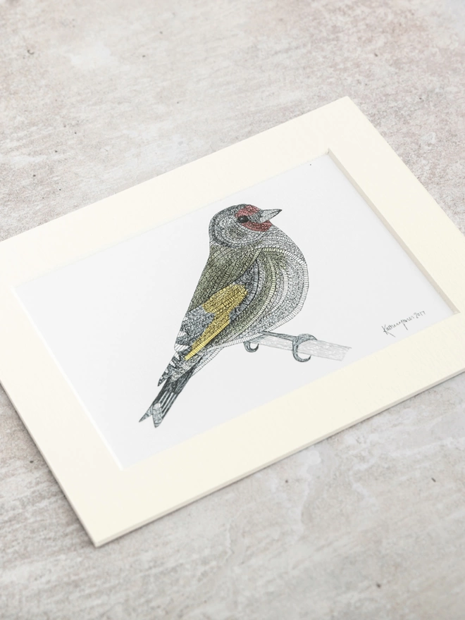 Print of intricately patterned pen and watercolour drawing of a Goldfinch bird, in a soft white mount