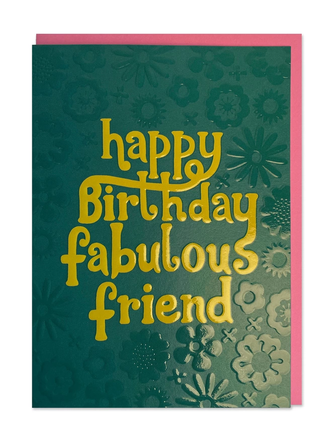 Birthday card with ’Happy Birthday fabulous friend’ message in chunky 70’s inspired hand lettering on a complementing dark green psychedelic embossed floral pattern  
