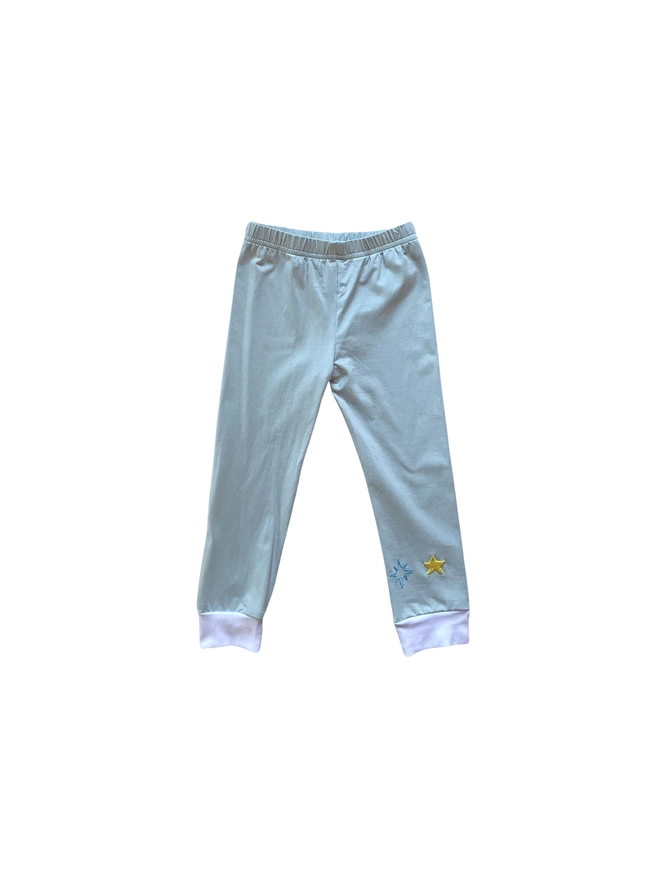 Pale blue grey pyjama bottoms with hand-embroidered stars and white cuffs