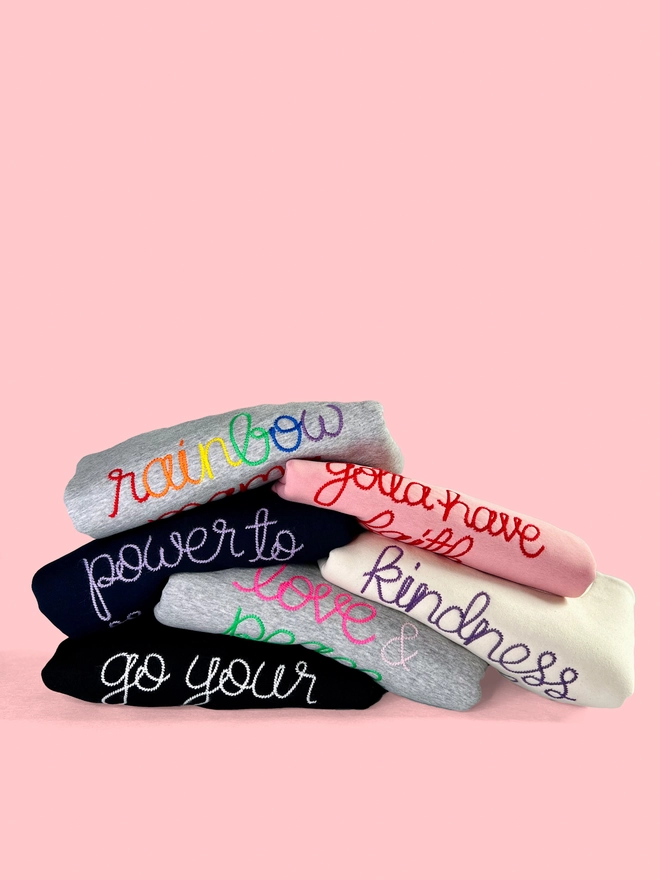 A colourful bundle of embroidered sweatshirts 