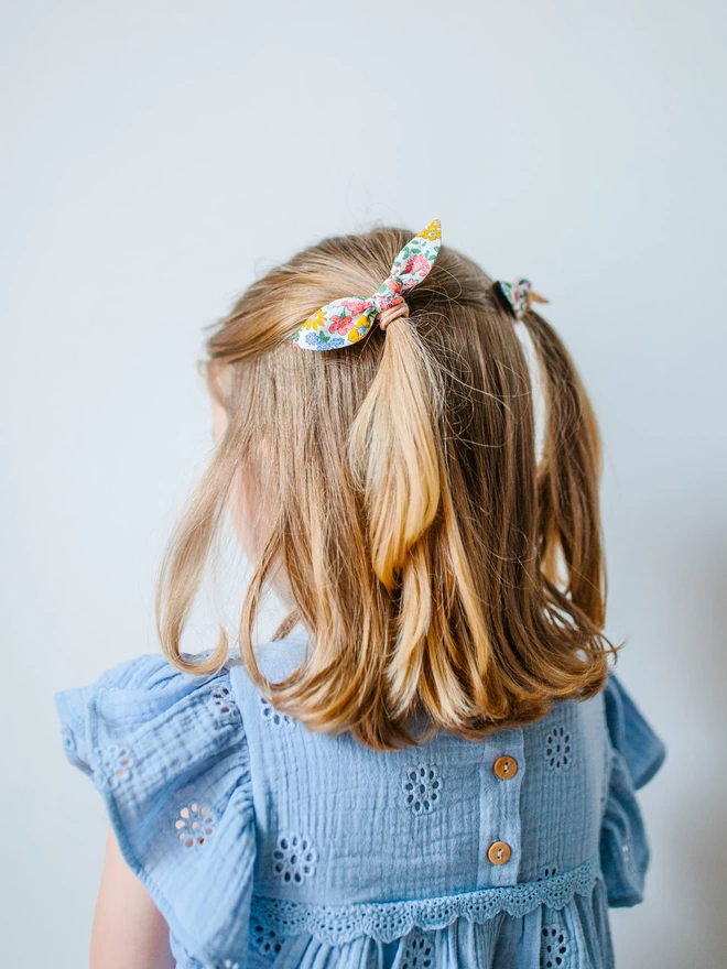 girl with pretty liberty hair bobbles