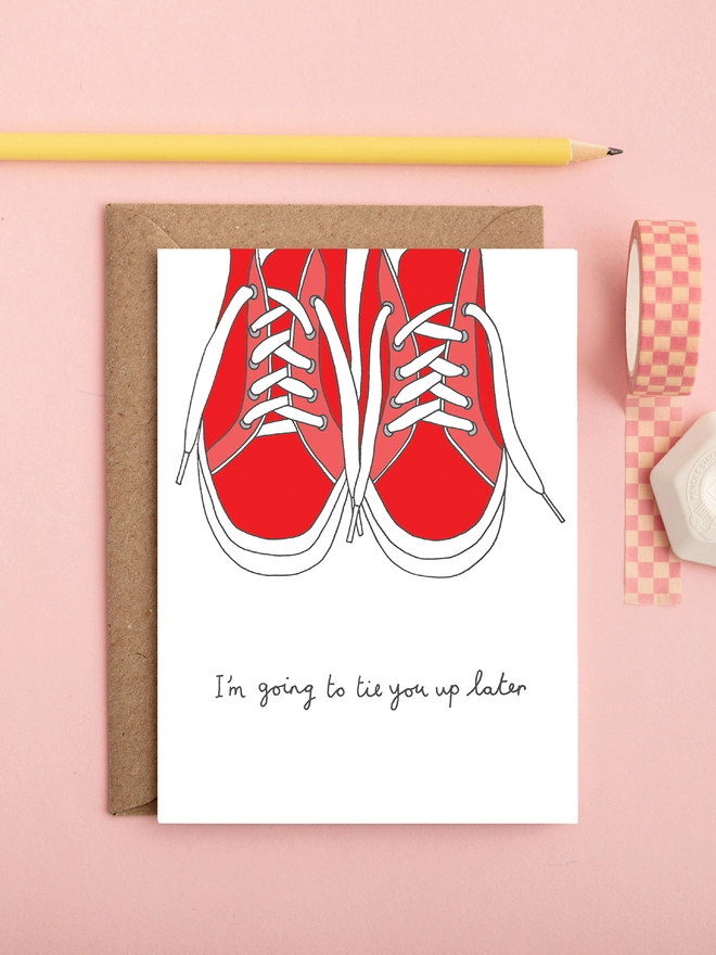 Humorous and risqué love card featuring trainers and laces