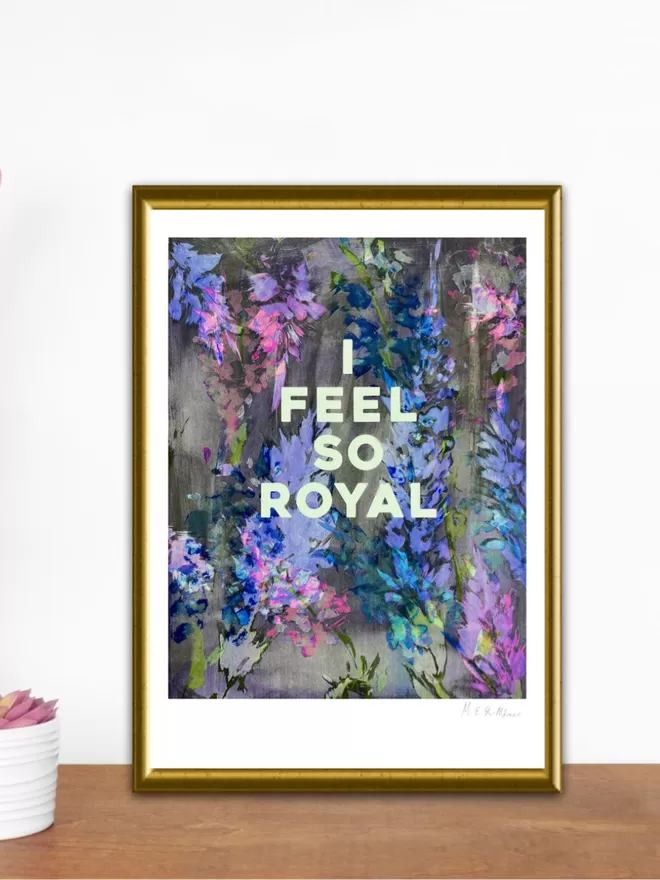 I FEEL SO ROYAL fine art print, based on an original monprint by M.E. Ster-Molnar.  Shown in a gold frame on a wood table.  