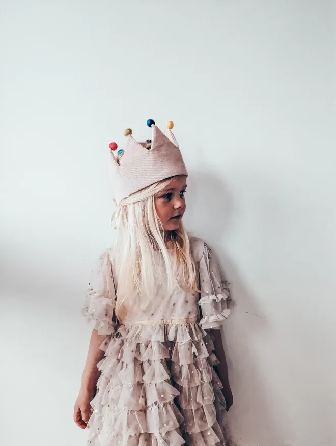 runaround Retro Dressing up Crown Girl wearing crown with pom poms