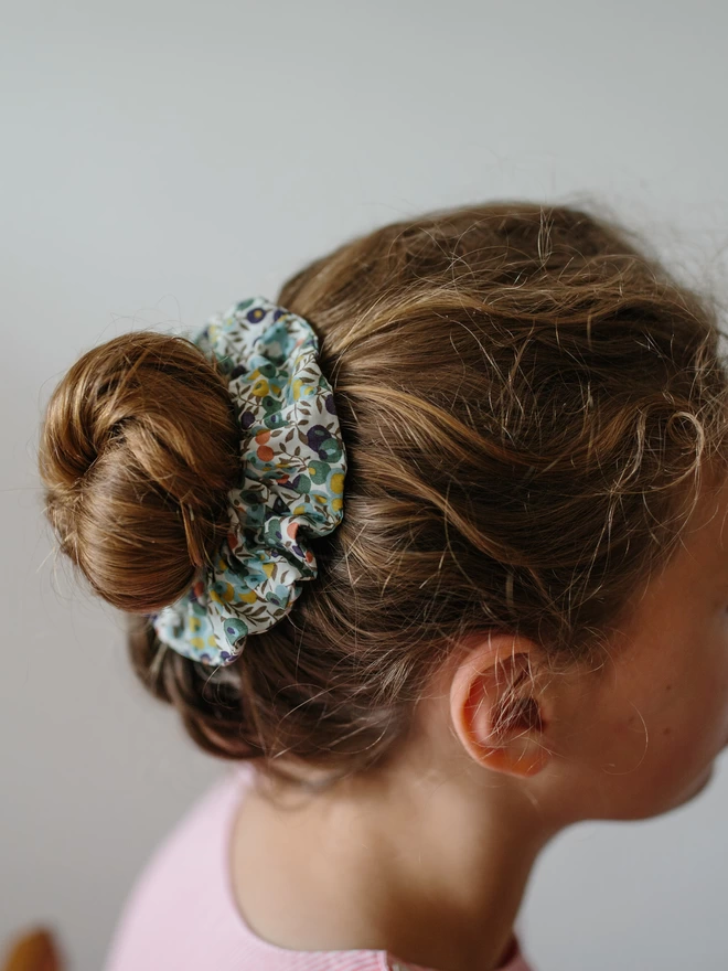 Little girl wearing a liberty hair scrunchie