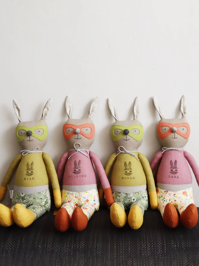 bunny rabbit dolls with superhero superhroine outfit in green and pink