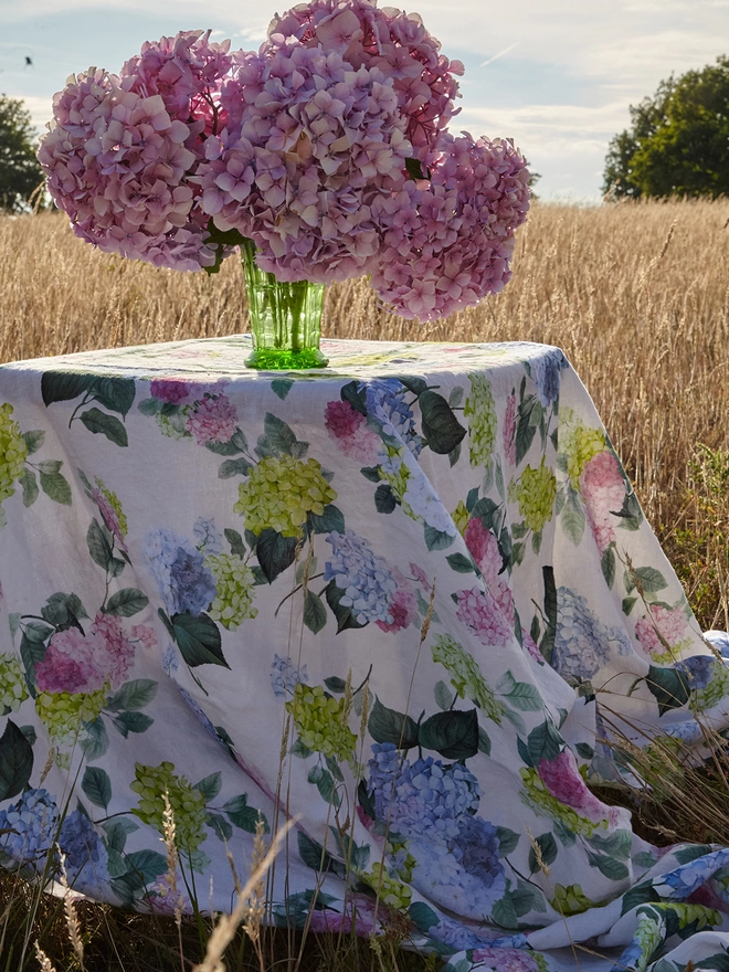 table laid with linen printed with hydrangea
