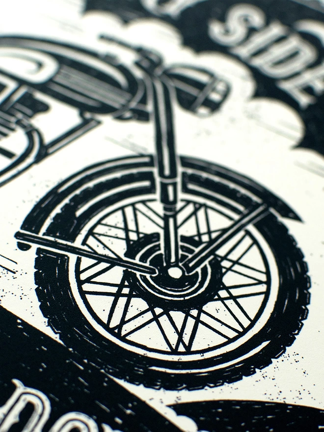 detail of black and white motorbike wheel