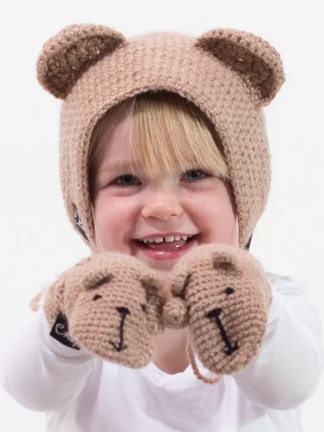 EKA Animal Mittens seen on a child wearing a bear hat.