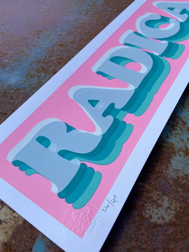 Bubblegum pink 'Radical' Hand Pulled Screen Print rectangular with neon pink and different blue shades of the word radical printed on top 