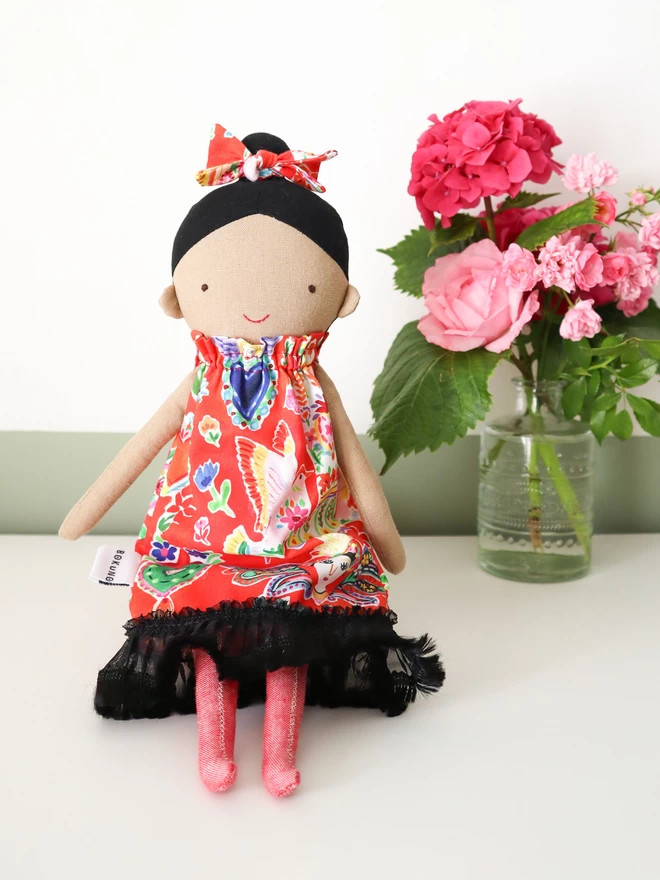 frida kahlo style doll with bright red dress and black hair
