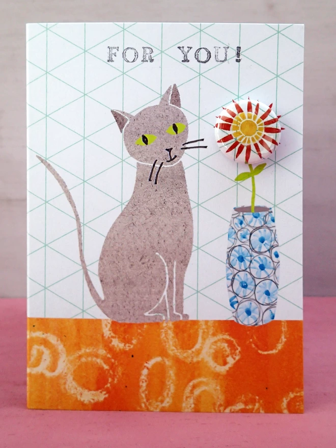 Cat with flower pin badge greeting card