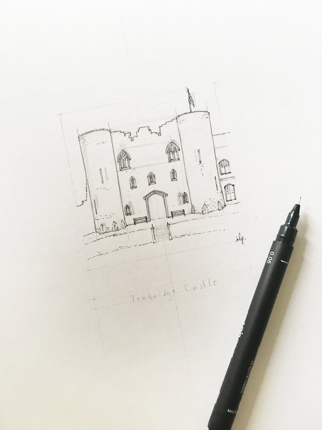 A work in progress sketch of Tonbridge Castle, in Tonbridge, Kent. The black pen outline is an organic loose style with small details being added in. A black fine line pen sits on top of the paper with the lid off as if ready to draw. A photo taken at an angle showing some of the detail. 