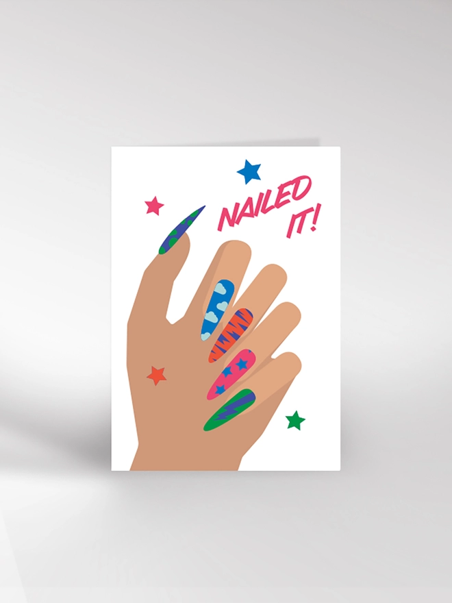 Greetings card with hand and brightly painted nails