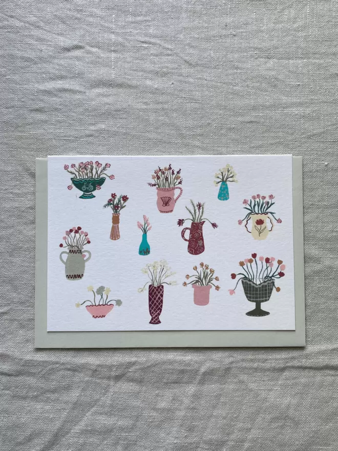 greetings card with floral arrangements on it