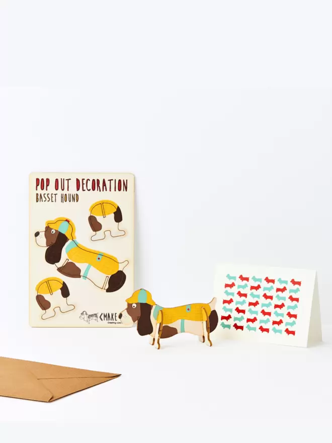 Basset Hound decoration and Basset Hound pattern greeting card and brown kraft envelope on a white background