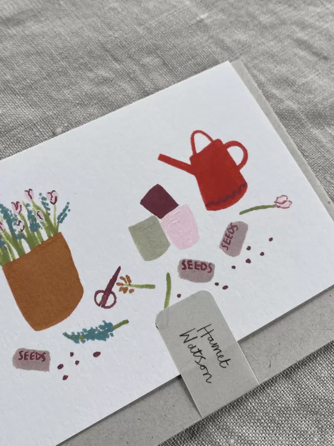 greetings card with watering can, seeds and plants on, perfect for gardeners.