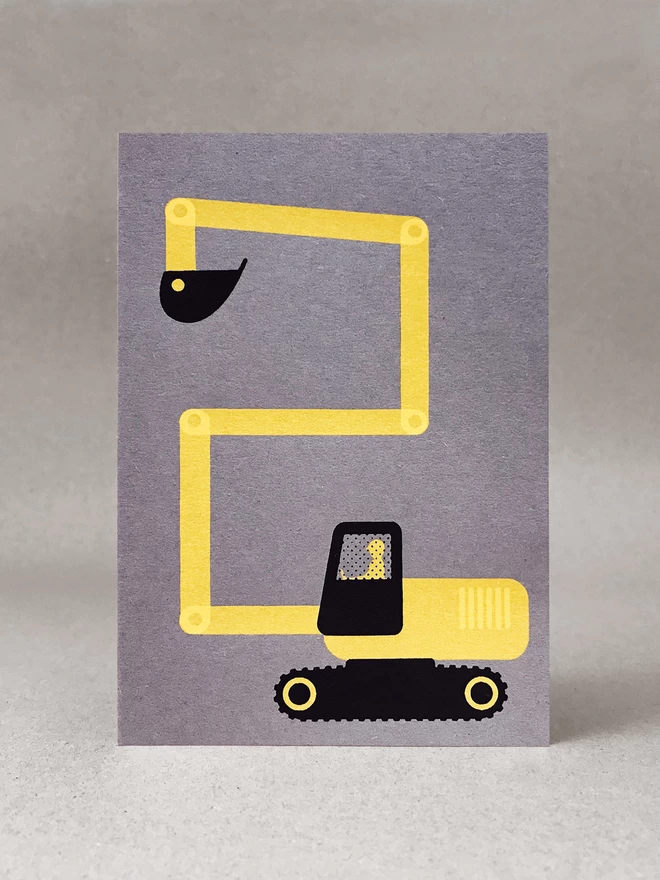 A digger making a number 2 with its digger arm, screenprinted in yellow and black ink on a grey card. 