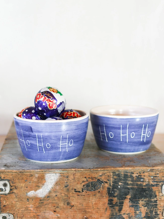 blue and white bowls with christmas chocolates