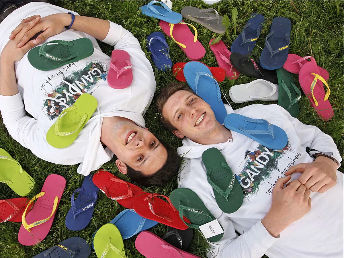 Rob and Paul Forkan surrounded by Gandy's flip flops