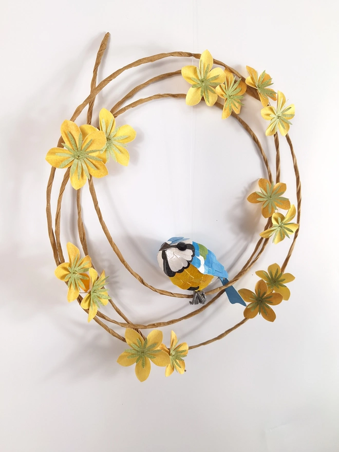 close up of the handmade paper flowers on the blue tit wreath