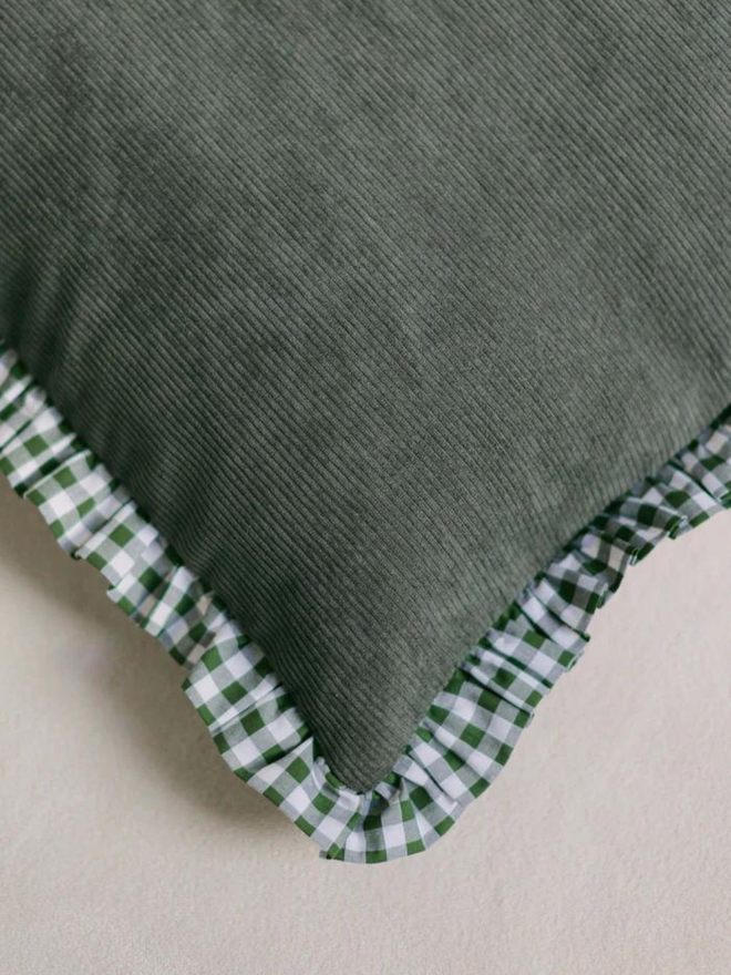 green corduroy and gingham dog bed corner