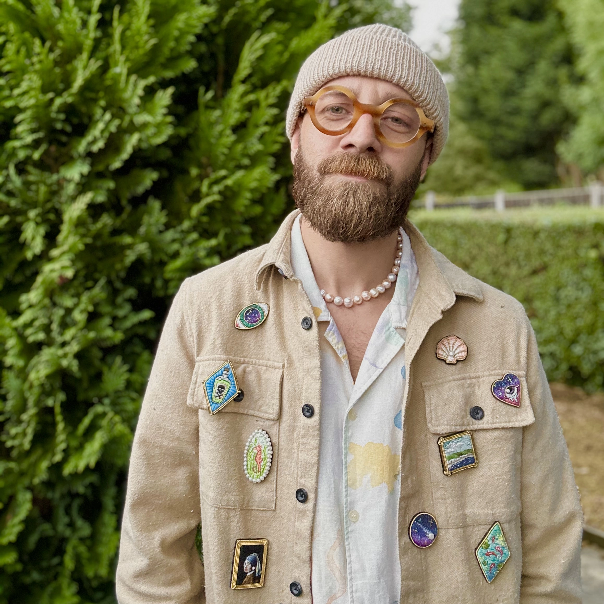 Simon wearing brooches on a jacket 