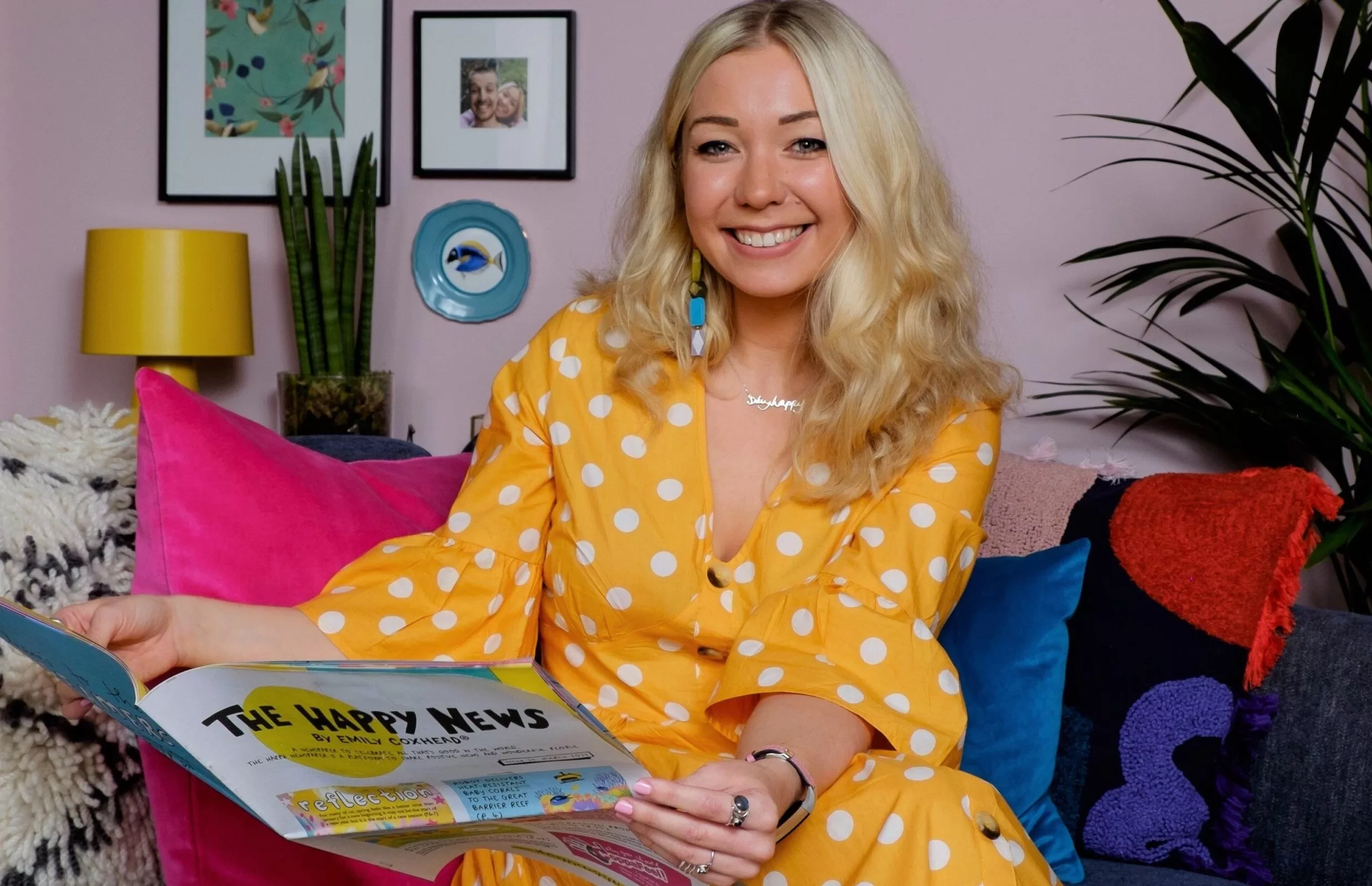 Emily Coxhead, founder of The Happy News, wearing a yellow dress 