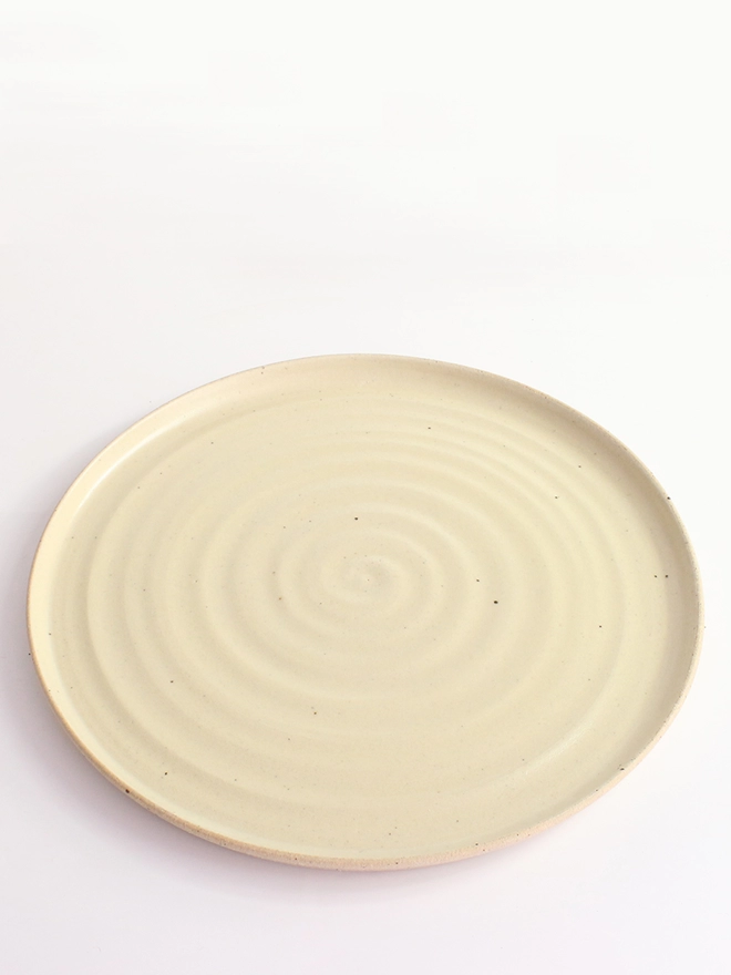 Large yellow dinner plate top view
