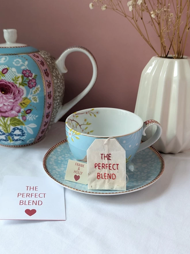 Embroidered The Perfect Blend teabag and sachet on cup 