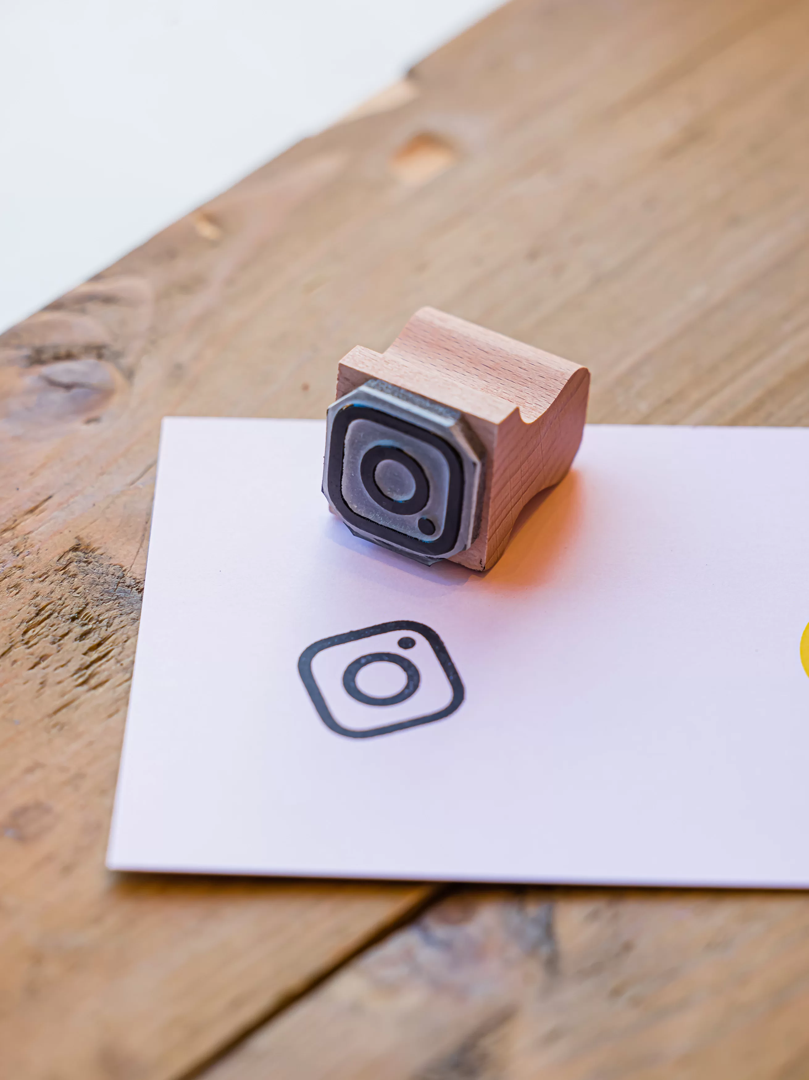 Rubber Stamp with Instagram Logo on white paper
