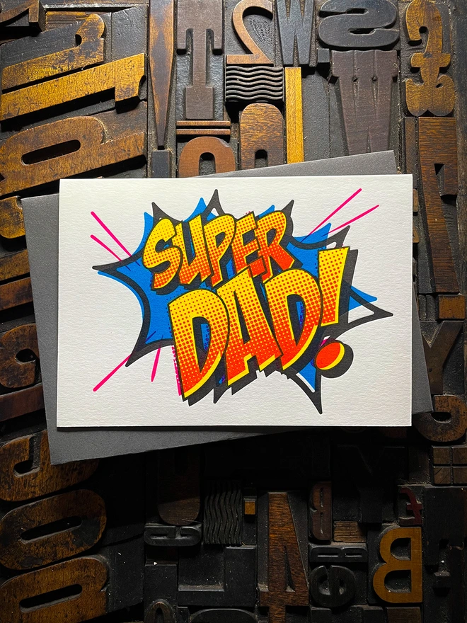 Pop Art Fathers day typographic letterpress card with fluorescent ink made by hand. Deep impression print. Unique with no print being the same. Vibrant colours with matching premium envelopes. With luxurious contrasting coloured envelopes.