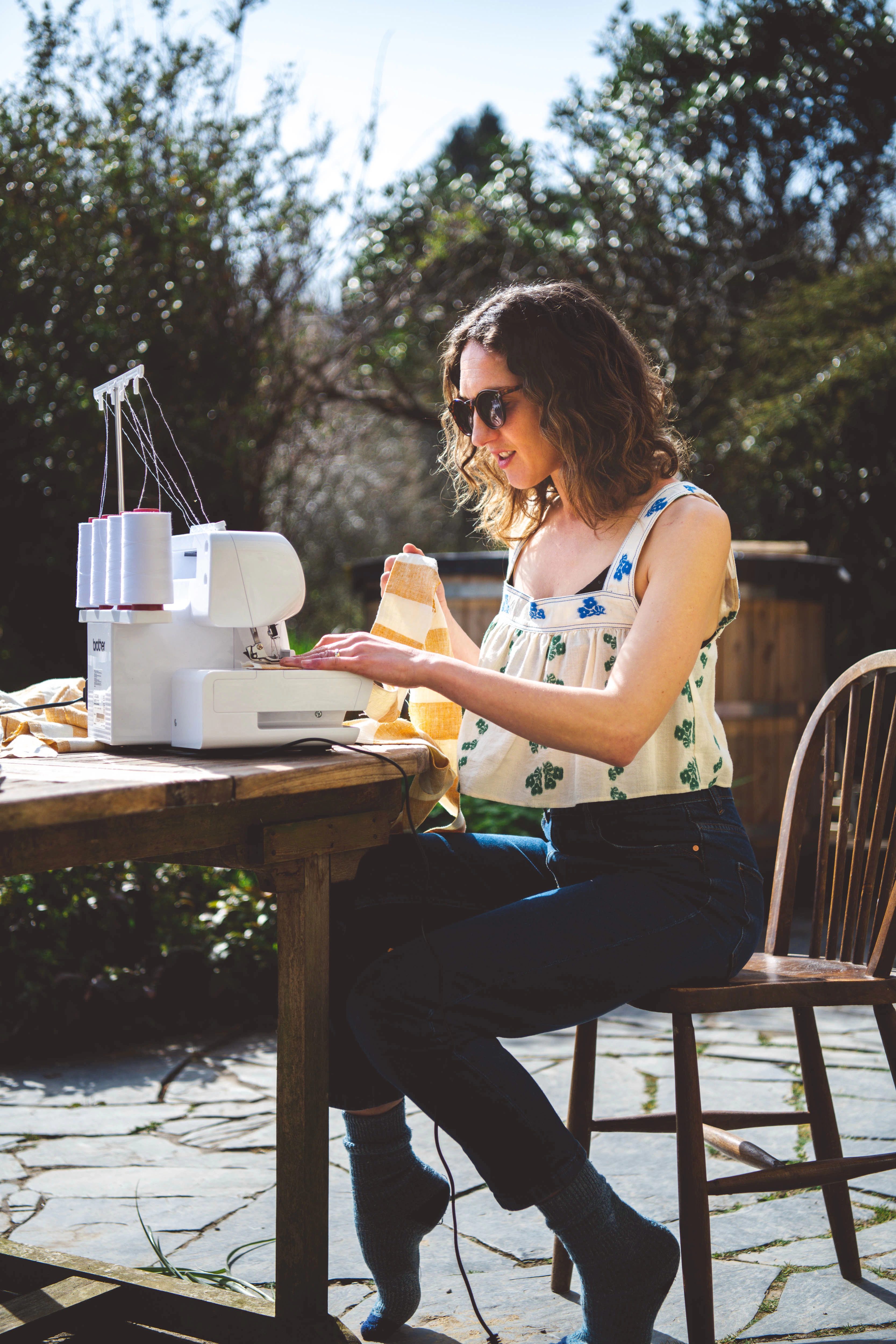 Loral Studio sewing outside 