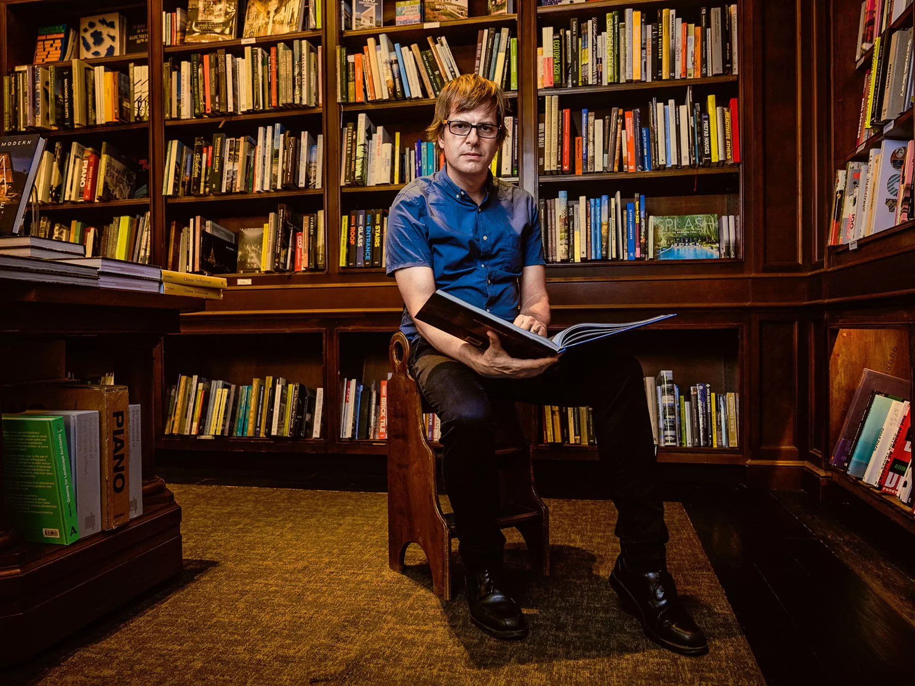 Andy Hunter, founder of bookshop.org, sat in a library