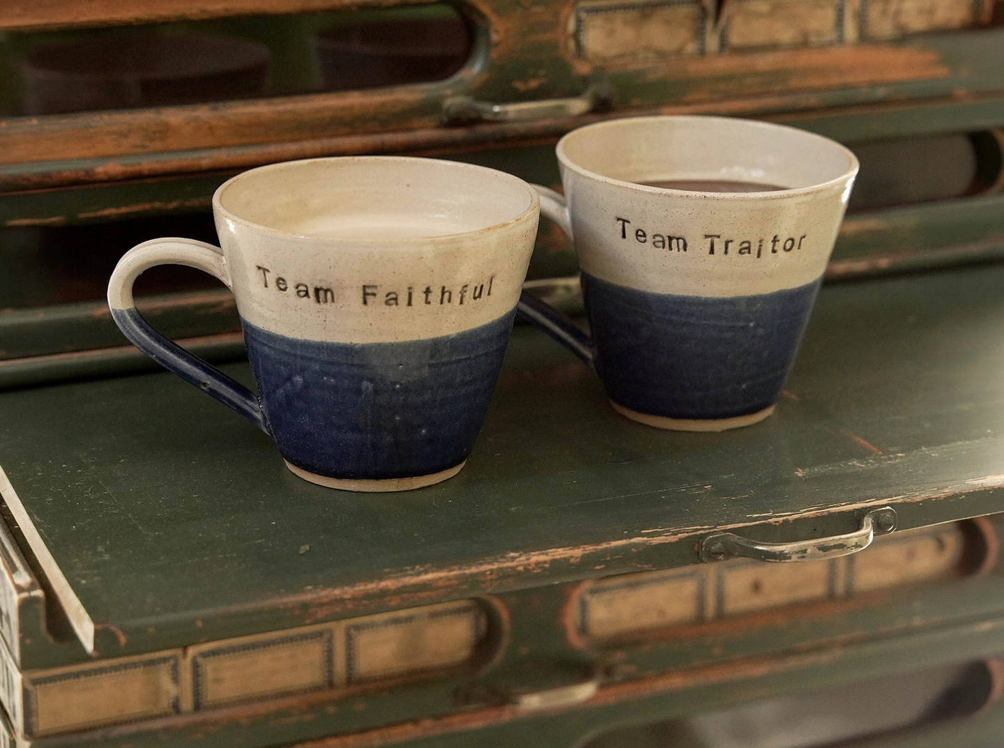Team faithful team traitor had stamped ceramic mugs