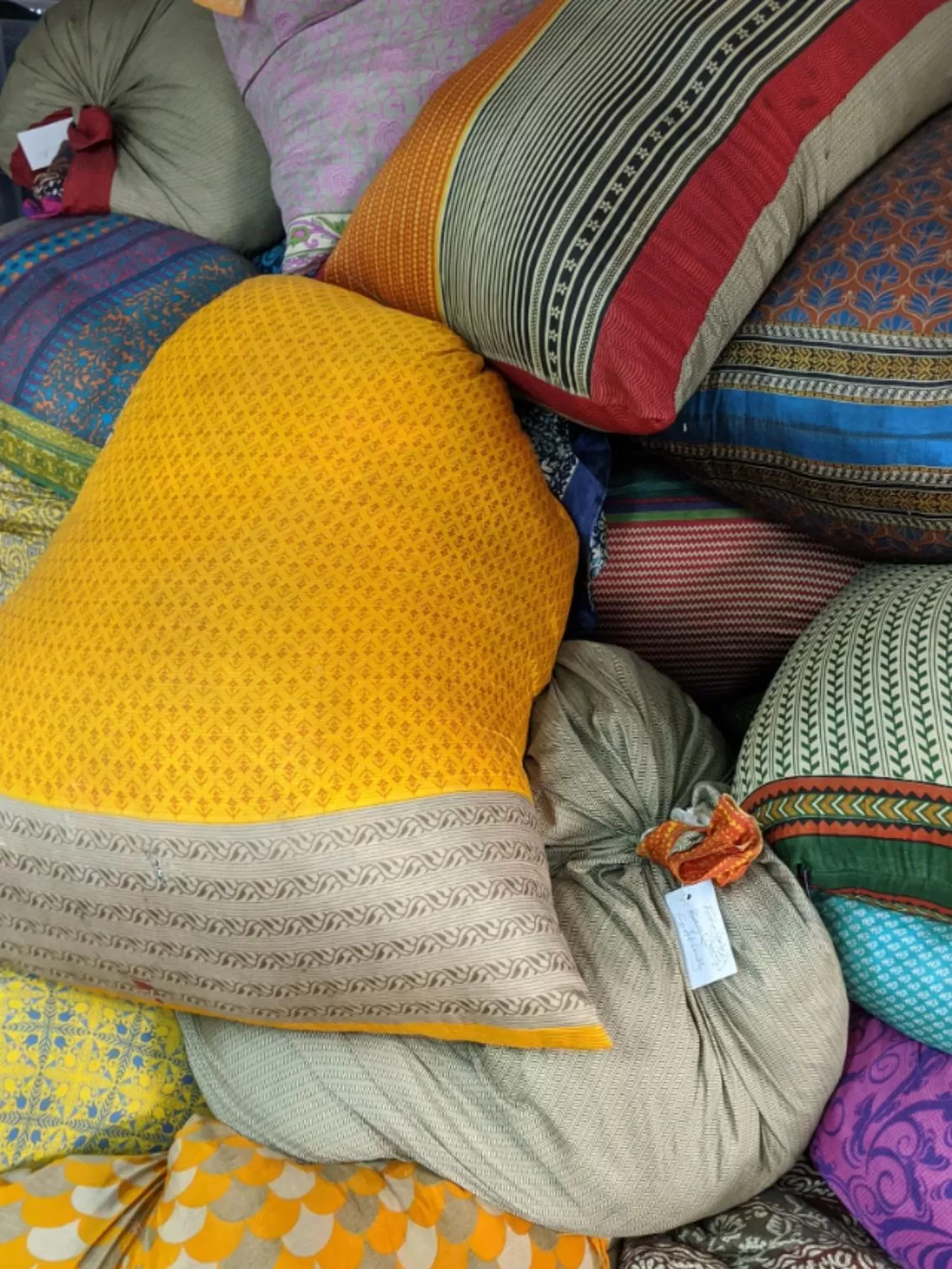 image of the bright coloured cushions and fabrics featured as their products