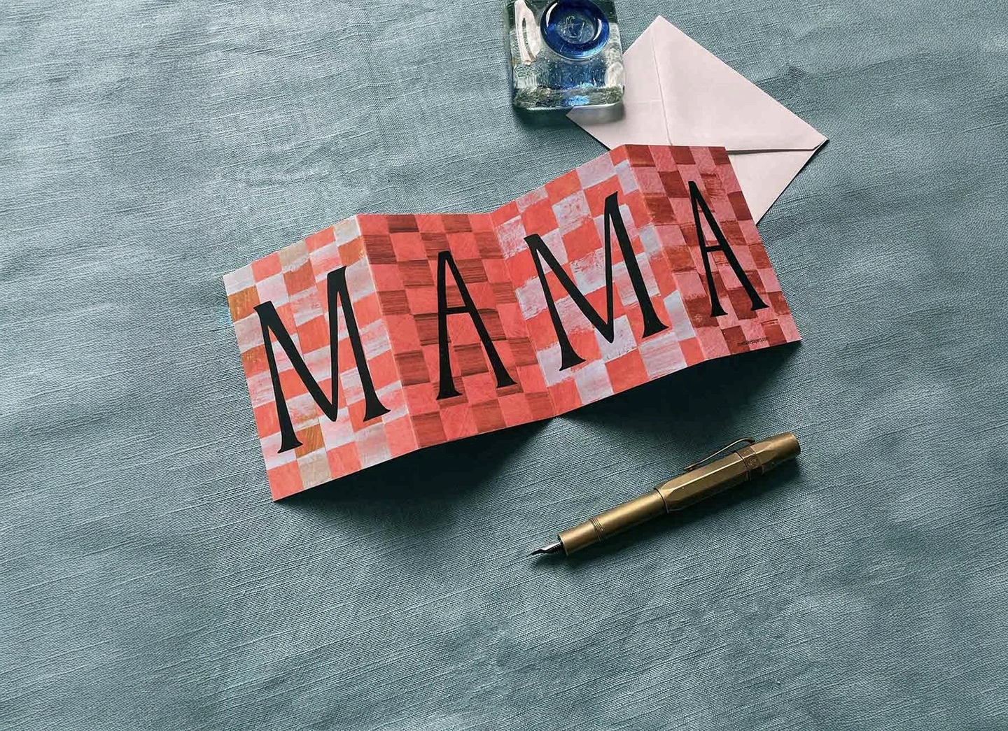 Mama concertina card. A pink chequerboard card with mama written on the front