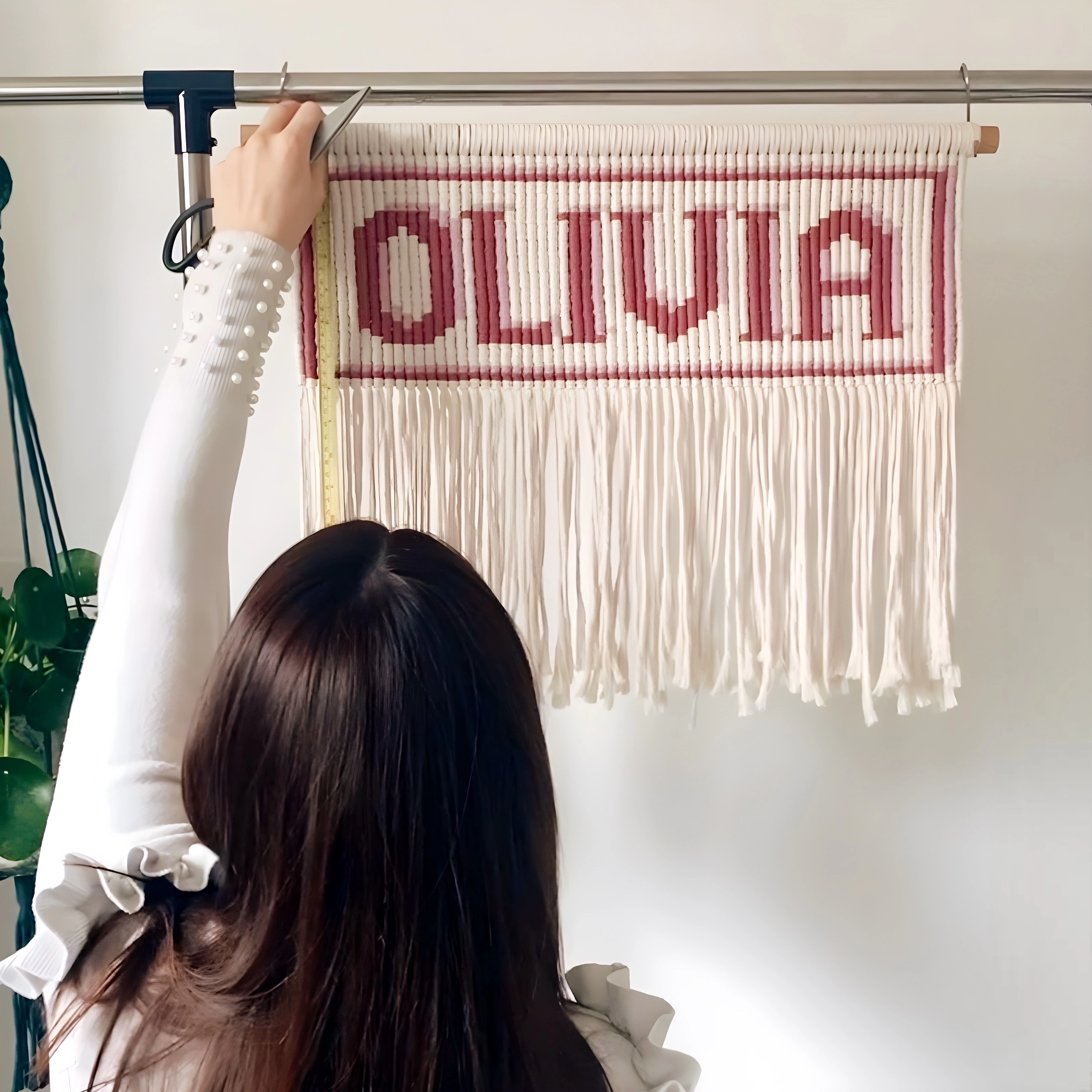 Photo of me cutting down Olivia personalised name banner down
