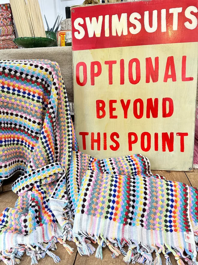 'Swimsuits Optional Beyond This Point' Sign