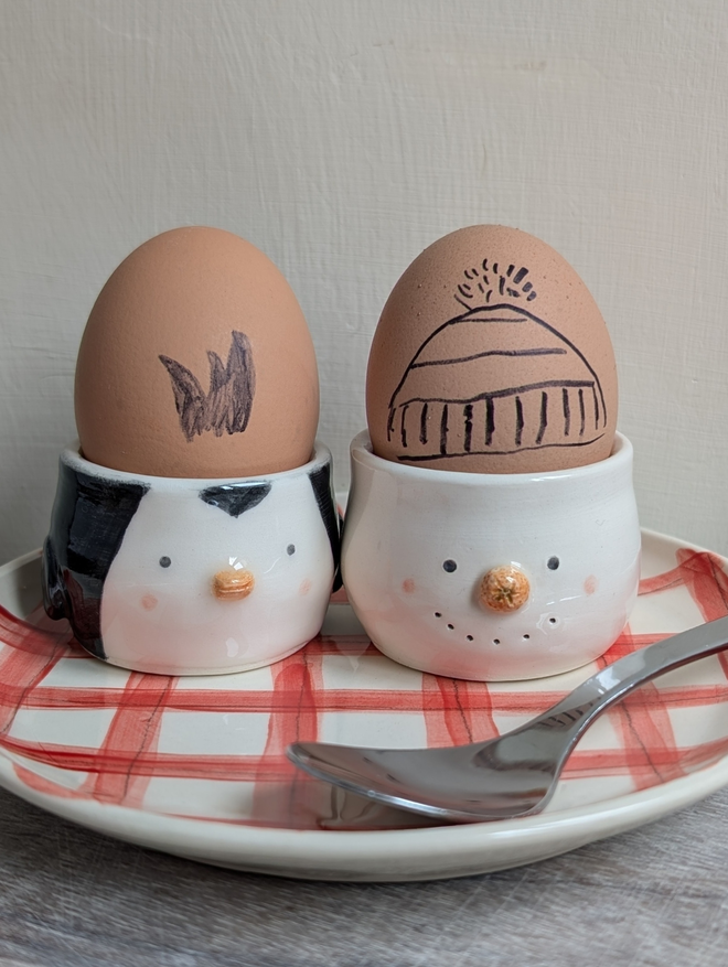 snowman and penguin ceramic egg cups