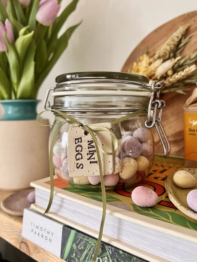 jar of mini eggs tied with a ceramic mini egg tag