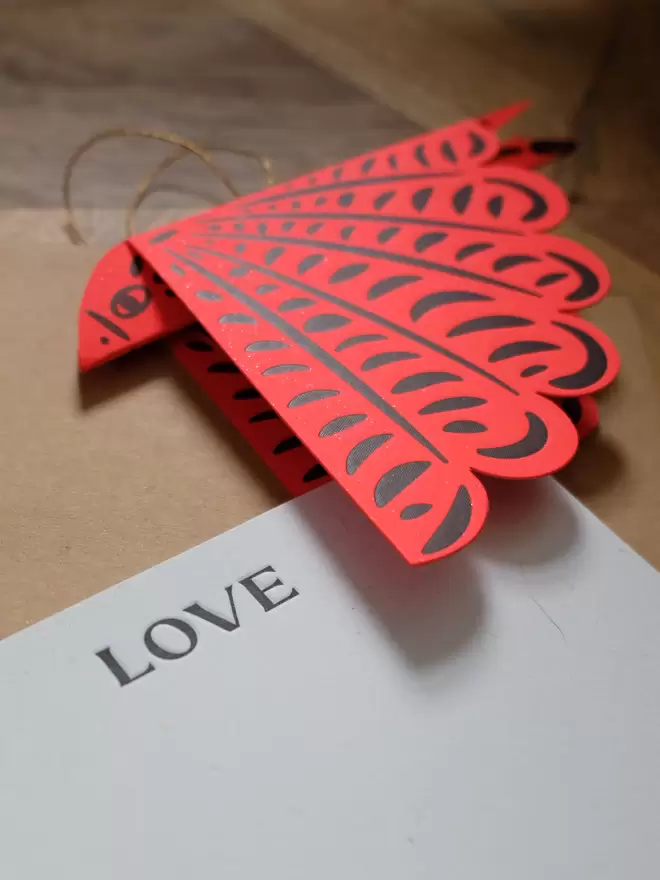 Red folded letterpress bird with 'Love' notecard.