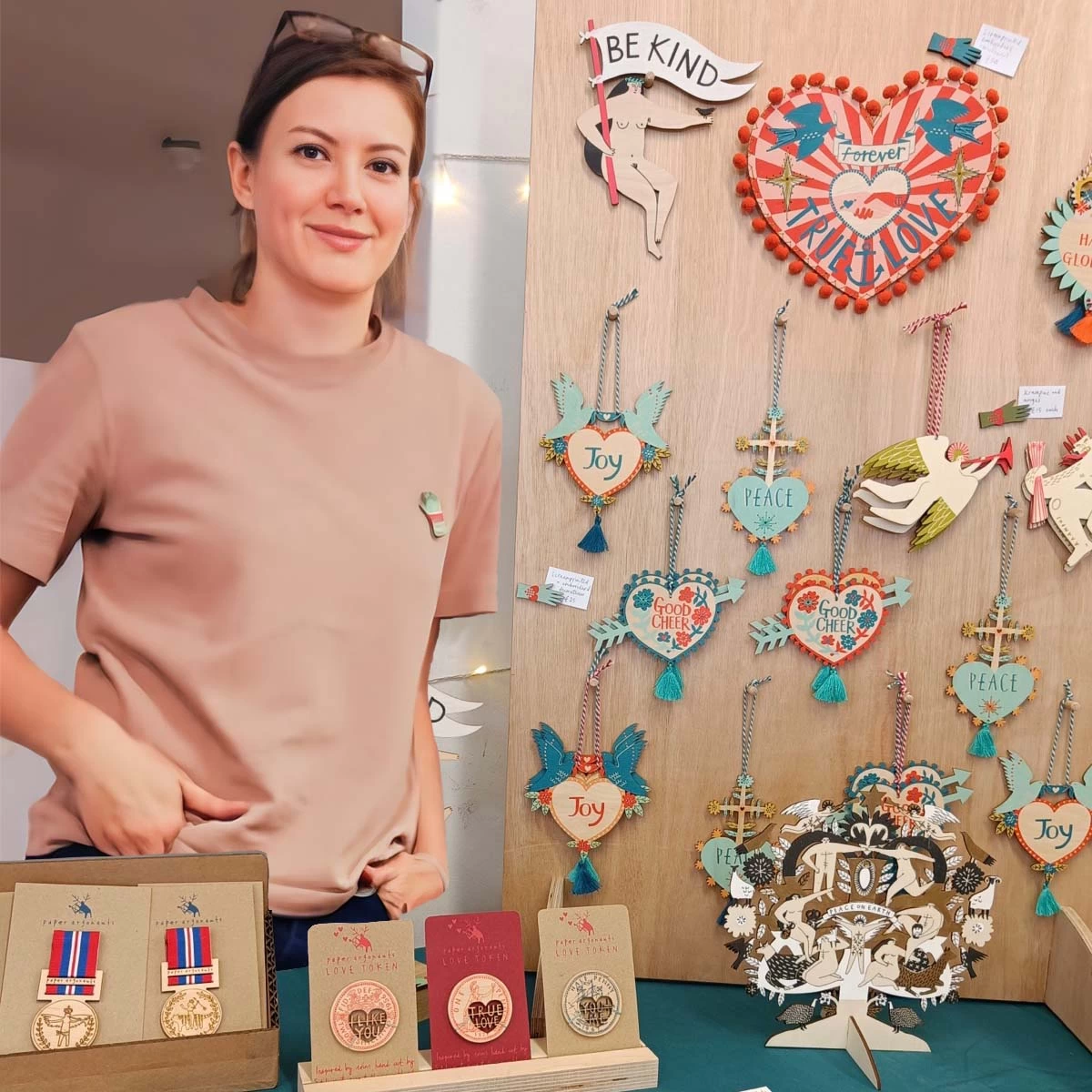 fiona biddington stands by her stall selling her colourful, joyful wooden screenprinted gifts