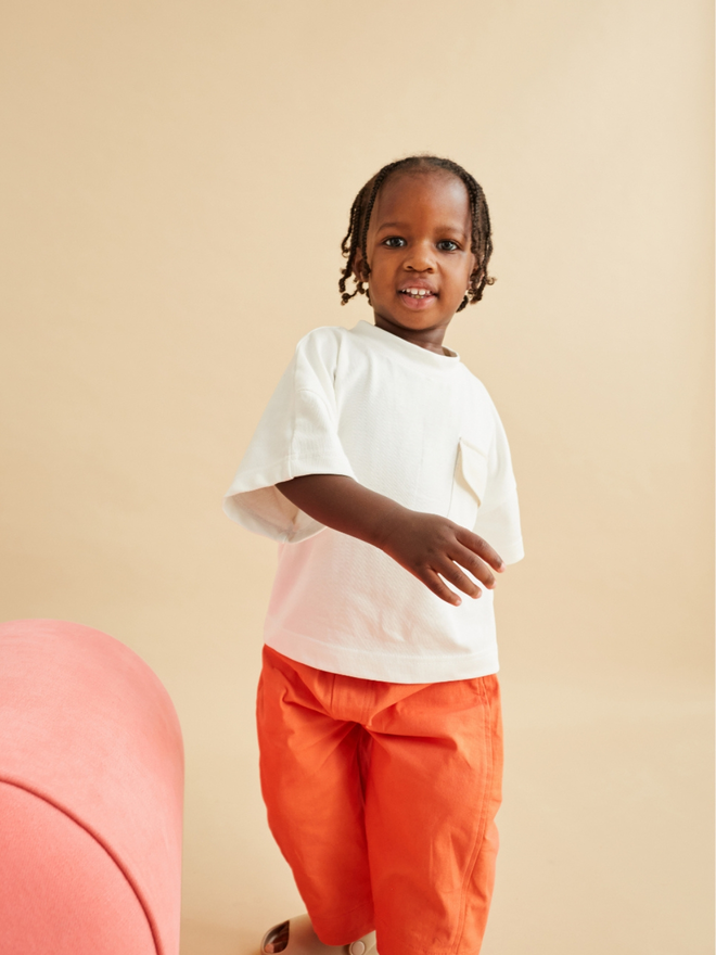 oversized white kids t-shirt with pocket made by small kids clothes shop in the uk